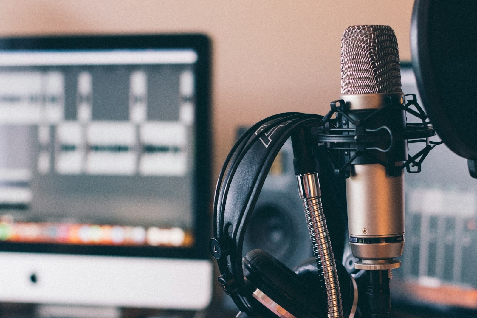 A studio microphone and headphones for recording a podcast