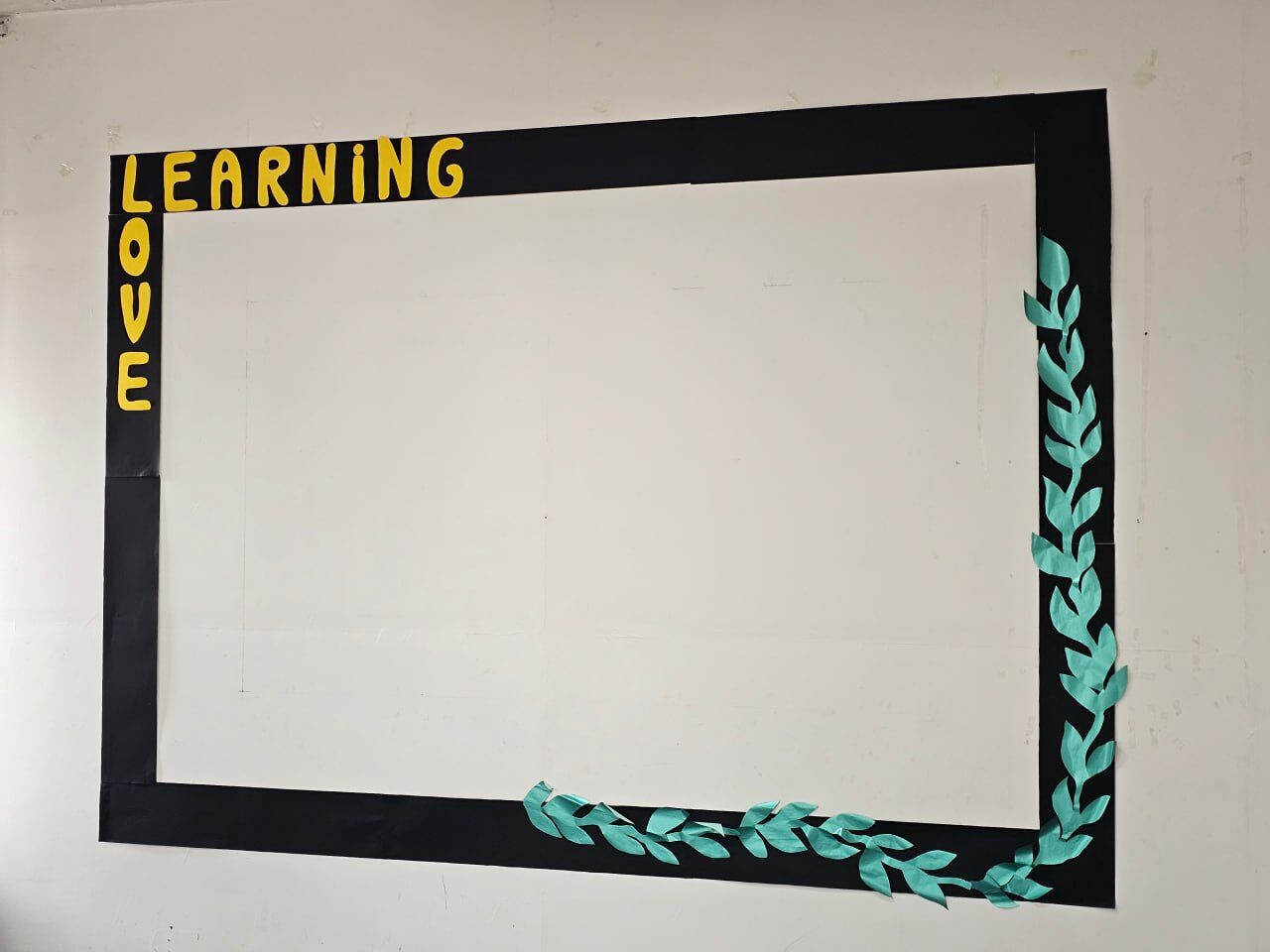 A wall frame that reads Love Learning